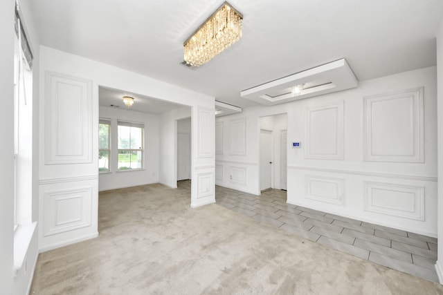3619 Barkers Run Dr, Houston, TX 77084 - spare room with light colored carpet and a decorative wall