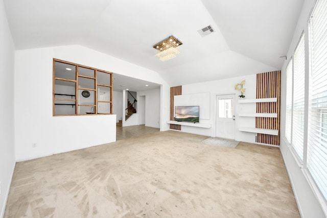 3619 Barkers Run Dr, Houston, TX 77084 - unfurnished living room with vaulted ceiling, stairs, and carpet