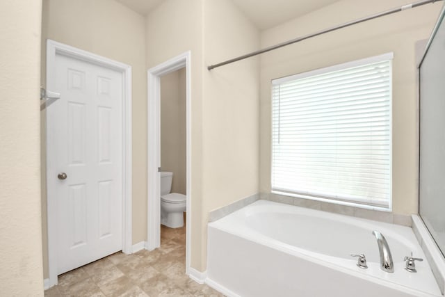 3619 Barkers Run Dr, Houston, TX 77084 - bathroom featuring a bath and healthy amount of natural light