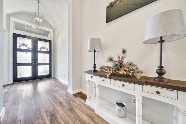 4327 Sage Glen Ln, Fulshear, TX 77441 - foyer entrance featuring french doors and wood finished floors