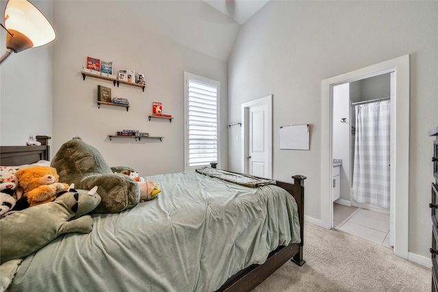 4327 Sage Glen Ln, Fulshear, TX 77441 - bedroom with light carpet, ensuite bathroom, and high vaulted ceiling