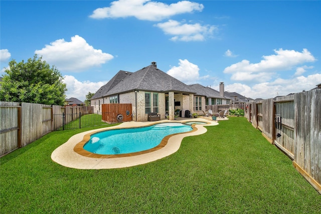 4327 Sage Glen Ln, Fulshear, TX 77441 - view of swimming pool featuring a pool with connected hot tub, a fenced backyard, and a patio area