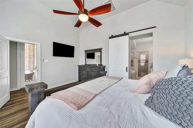 4327 Sage Glen Ln, Fulshear, TX 77441 - bedroom with vaulted ceiling, a barn door, dark wood-style flooring, ceiling fan, and connected bathroom