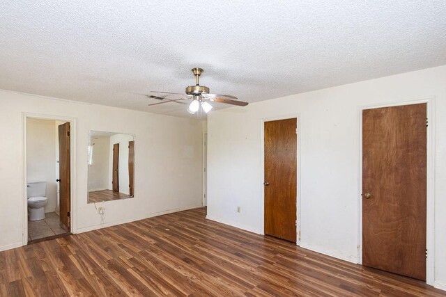 8111 Dellanera Dr, Hitchcock, TX 77563 - unfurnished bedroom featuring wood finished floors, a textured ceiling, ensuite bath, and ceiling fan