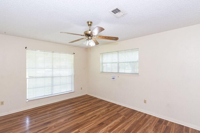 8111 Dellanera Dr, Hitchcock, TX 77563 - unfurnished room with wood finished floors, ceiling fan, and a textured ceiling
