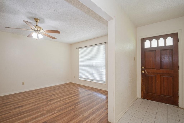 8111 Dellanera Dr, Hitchcock, TX 77563 - entryway featuring plenty of natural light, a textured ceiling, light wood-style flooring, and ceiling fan