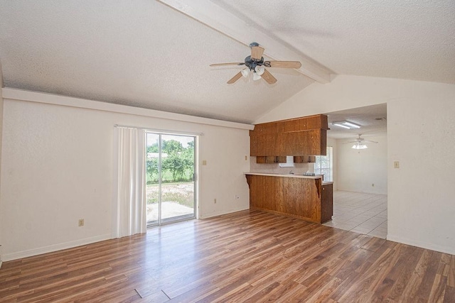 8111 Dellanera Dr, Hitchcock, TX 77563 - unfurnished living room featuring ceiling fan, a textured ceiling, and wood finished floors