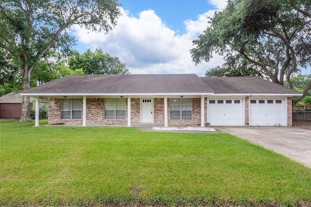 8111 Dellanera Dr, Hitchcock, TX 77563 - ranch-style house with a garage, driveway, and brick siding
