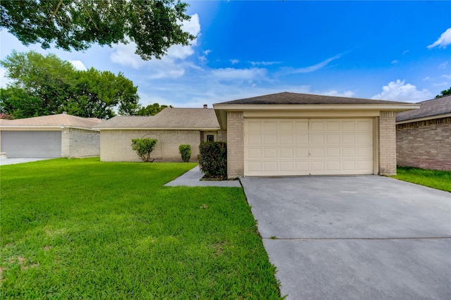 2710 Magnolia Ct, Stafford, TX 77477 - view of front of house featuring brick siding, a front yard, a garage, and driveway