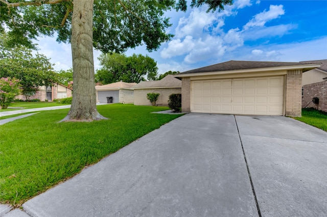 2710 Magnolia Ct, Stafford, TX 77477 - single story home featuring brick siding, a front yard, and driveway