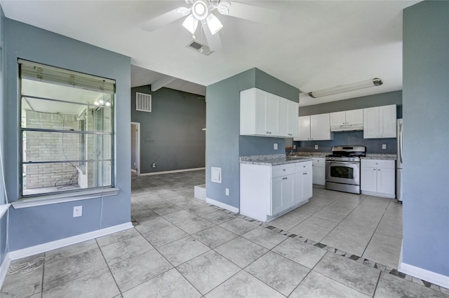 2710 Magnolia Ct, Stafford, TX 77477 - kitchen featuring appliances with stainless steel finishes, under cabinet range hood, white cabinetry, a ceiling fan, and light tile patterned flooring