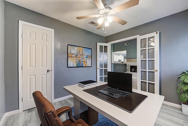 2710 Magnolia Ct, Stafford, TX 77477 - home office featuring light wood-type flooring and ceiling fan