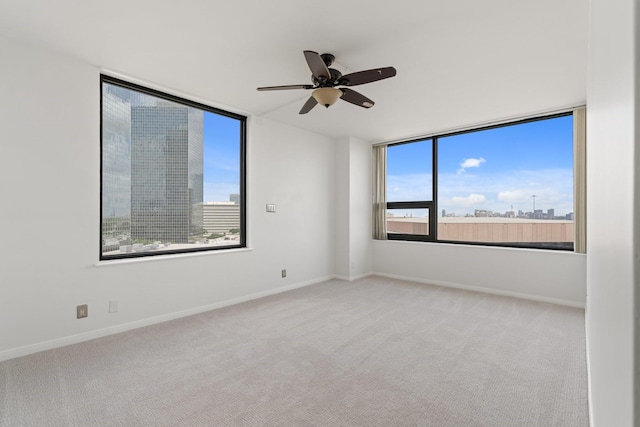 15 Greenway Plz Unit 10G, Houston, TX 77046 - carpeted spare room with plenty of natural light and ceiling fan