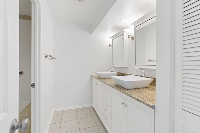 15 Greenway Plz Unit 10G, Houston, TX 77046 - bathroom featuring double vanity and tile patterned floors