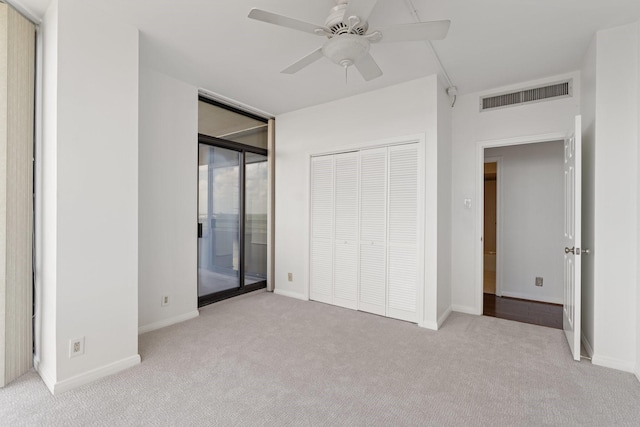 15 Greenway Plz Unit 10G, Houston, TX 77046 - unfurnished bedroom featuring light colored carpet, access to outside, ceiling fan, and a closet