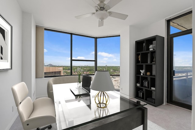 15 Greenway Plz Unit 10G, Houston, TX 77046 - carpeted office featuring a wall of windows, plenty of natural light, and ceiling fan