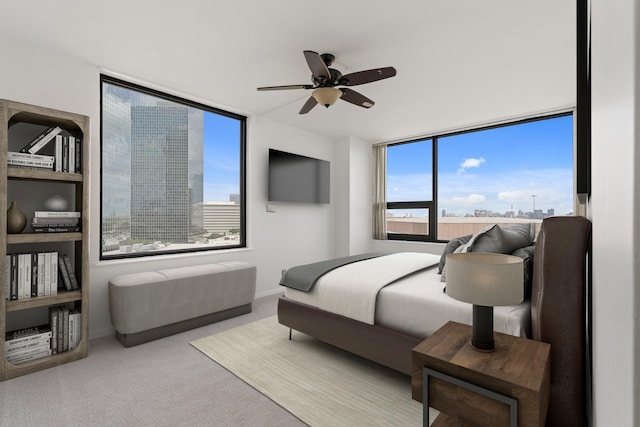 15 Greenway Plz Unit 10G, Houston, TX 77046 - bedroom with multiple windows, carpet flooring, and ceiling fan