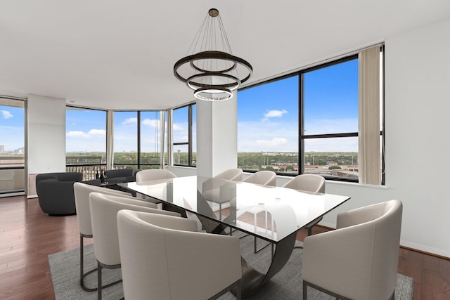 15 Greenway Plz Unit 10G, Houston, TX 77046 - dining room featuring a wall of windows, wood finished floors, plenty of natural light, and a chandelier