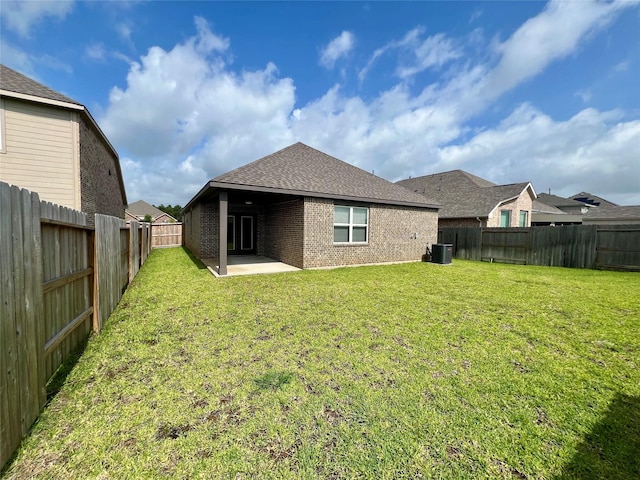 3049 Myrtle Sunset Dr, Katy, TX 77493 - back of property with brick siding, a patio, a fenced backyard, and roof with shingles