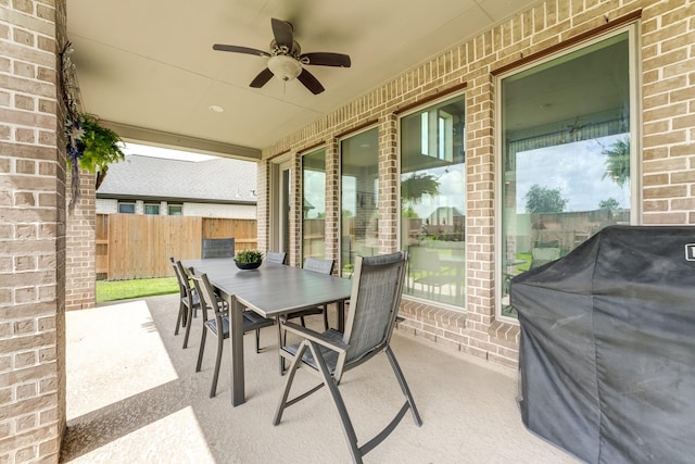 6907 Pondhawk Dr, Katy, TX 77493 - view of patio with a grill, outdoor dining area, and ceiling fan