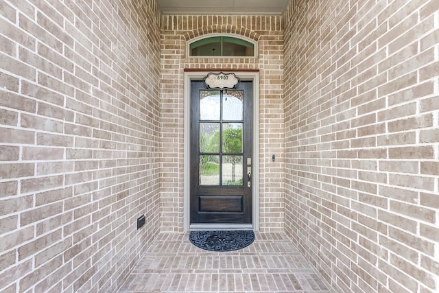 6907 Pondhawk Dr, Katy, TX 77493 - view of exterior entry featuring brick siding