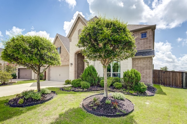 6907 Pondhawk Dr, Katy, TX 77493 - obstructed view of property featuring brick siding, a garage, driveway, and a shingled roof