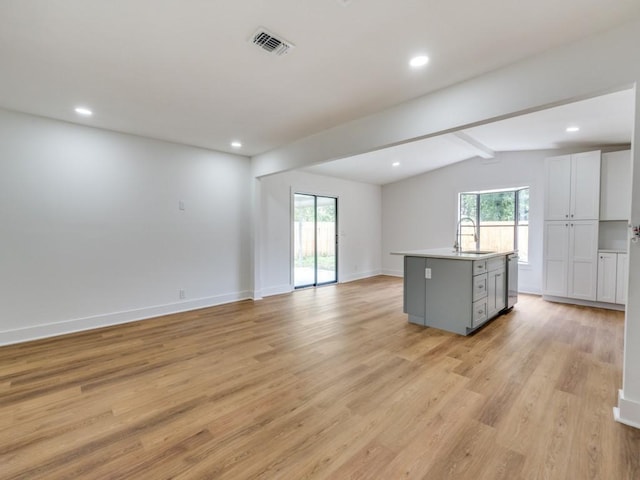 527 Blakeley Dr, San Antonio, TX 78209 - unfurnished living room featuring light wood finished floors, healthy amount of natural light, and recessed lighting