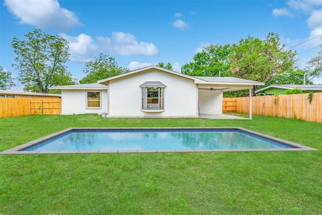 527 Blakeley Dr, San Antonio, TX 78209 - back of house featuring a fenced backyard, ceiling fan, and stucco siding