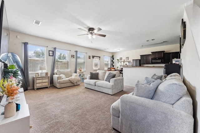 2415 Fallen Pine Ln, Houston, TX 77088 - living room featuring a ceiling fan and light colored carpet