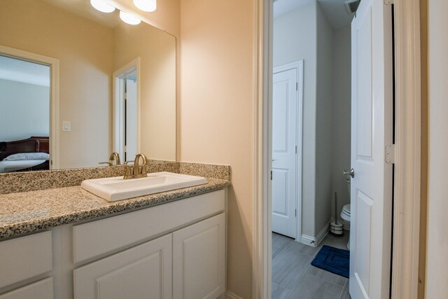 9411 Plaza Point Dr, Missouri City, TX 77459 - ensuite bathroom with vanity and toilet