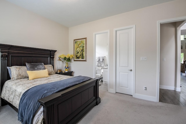 9411 Plaza Point Dr, Missouri City, TX 77459 - bedroom with light colored carpet and ensuite bathroom