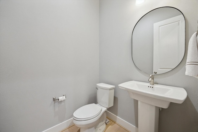 408 W Pierce St, Houston, TX 77019 - half bath featuring baseboards and wood finished floors