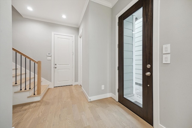 408 W Pierce St, Houston, TX 77019 - entrance foyer featuring ornamental molding, wood finished floors, stairway, and recessed lighting
