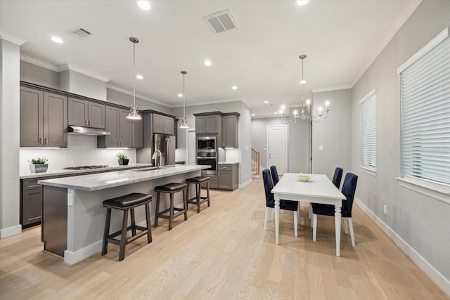 408 W Pierce St, Houston, TX 77019 - dining room with a chandelier, light wood-style flooring, ornamental molding, and recessed lighting