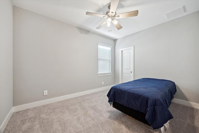 408 W Pierce St, Houston, TX 77019 - carpeted bedroom featuring baseboards and a ceiling fan