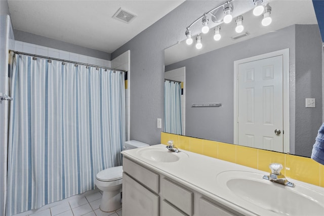 1011 Elm Pointe, League City, TX 77573 - bathroom with a textured wall, tile patterned flooring, double vanity, and a shower with shower curtain