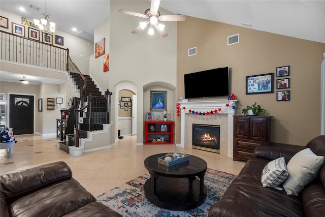 1011 Elm Pointe, League City, TX 77573 - tiled living area with high vaulted ceiling, a ceiling fan, stairway, a chandelier, and a tile fireplace