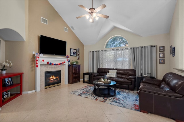 1011 Elm Pointe, League City, TX 77573 - tiled living room featuring a ceiling fan, a tiled fireplace, and high vaulted ceiling