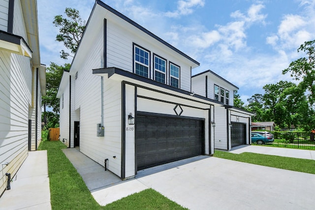 8159 Crestview Dr, Houston, TX 77028 - view of front of home featuring concrete driveway and a garage