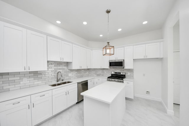 8159 Crestview Dr, Houston, TX 77028 - kitchen with stainless steel appliances, a center island, white cabinets, and recessed lighting