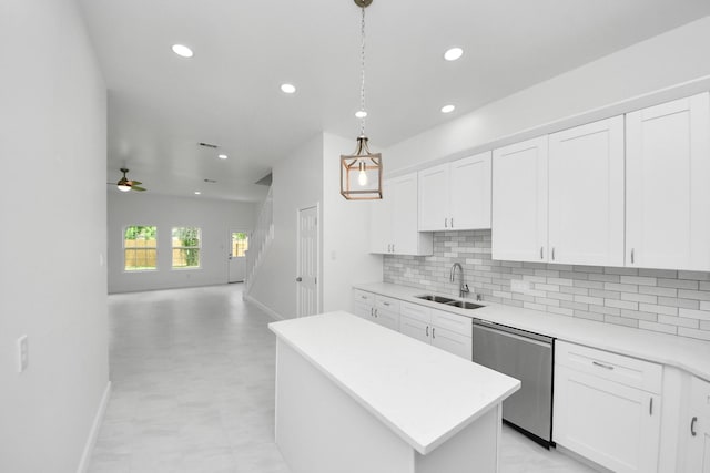8159 Crestview Dr, Houston, TX 77028 - kitchen featuring stainless steel dishwasher, recessed lighting, a kitchen island, decorative backsplash, and a ceiling fan