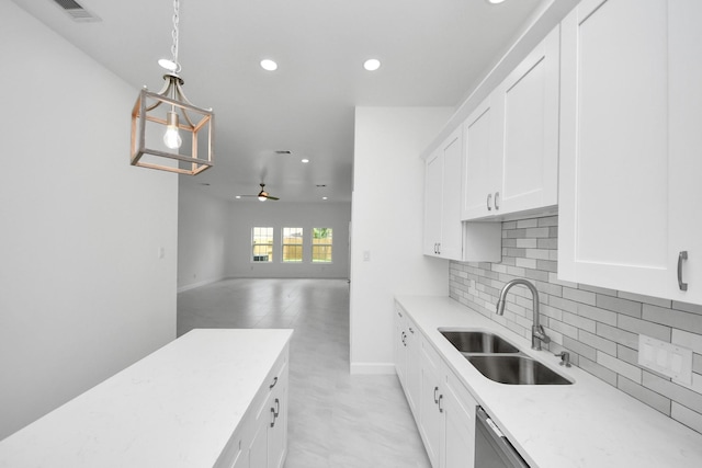 8159 Crestview Dr, Houston, TX 77028 - kitchen featuring recessed lighting, backsplash, open floor plan, white cabinets, and pendant lighting