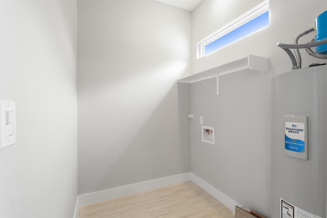 301 Knights Row, Horseshoe Bay, TX 78657 - washroom featuring water heater, washer hookup, and light wood-style floors