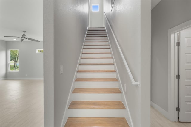 301 Knights Row, Horseshoe Bay, TX 78657 - stairs featuring a ceiling fan and wood finished floors