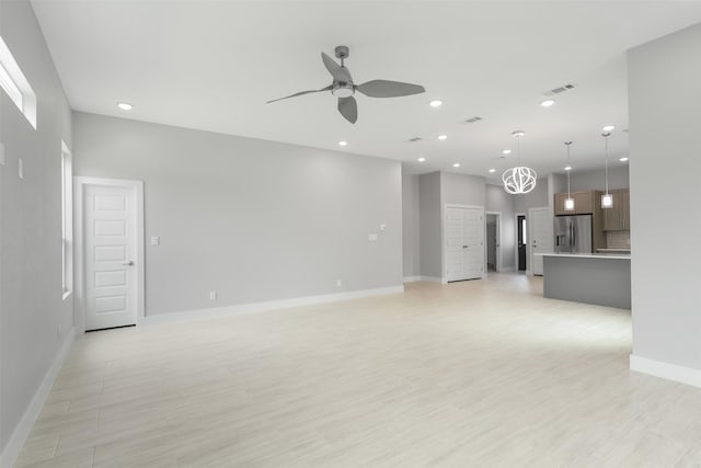 301 Knights Row, Horseshoe Bay, TX 78657 - unfurnished living room with a ceiling fan, recessed lighting, and light wood finished floors