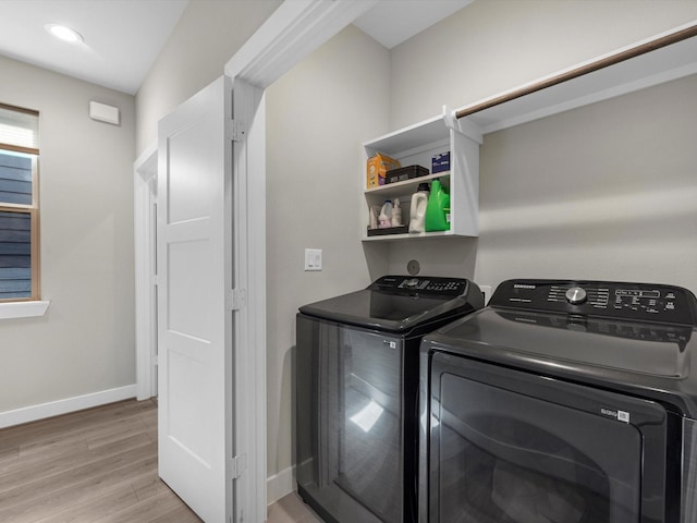 307 Charlock St, Houston, TX 77022 - laundry area with washing machine and dryer, light wood finished floors, and recessed lighting