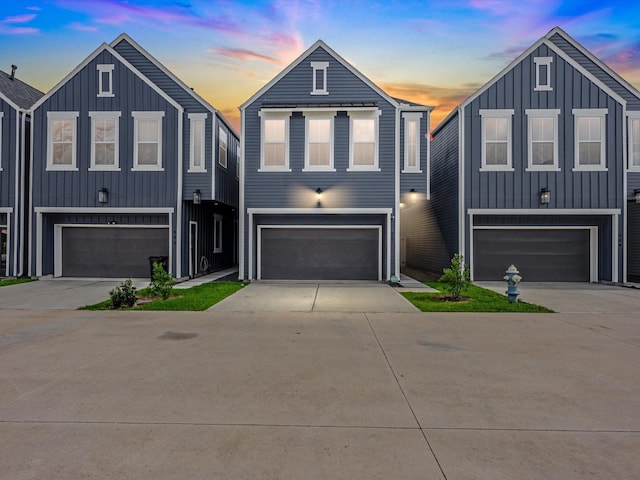 307 Charlock St, Houston, TX 77022 - view of front of property featuring board and batten siding, an attached garage, and concrete driveway