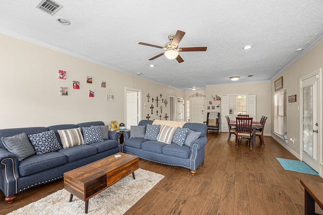 7202 N Fawn River Cir, Spring, TX 77379 - living area featuring a textured ceiling, ceiling fan, dark wood-type flooring, crown molding, and recessed lighting