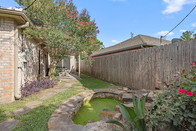 7202 N Fawn River Cir, Spring, TX 77379 - fenced backyard featuring a patio area
