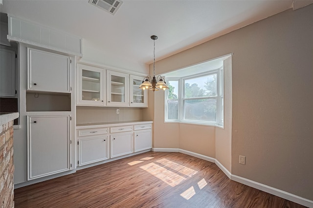 22303 Walnut Valley Dr, Spring, TX 77389 - unfurnished dining area featuring wood finished floors and a chandelier
